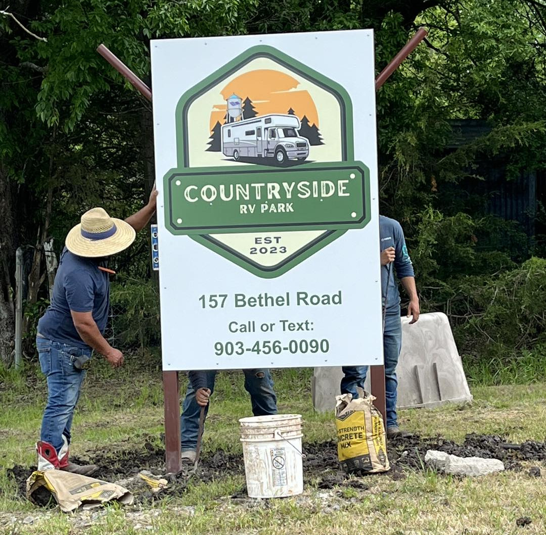 Putting up our new sign